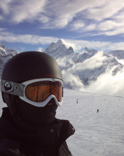 Joel bundled up and skiing in Switzerland